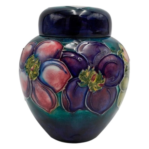 220 - MOORCROFT MAGNOLIA PATTERN COVERED JARCIRCA 1980signed and with impressed marks, 15cm high; together... 