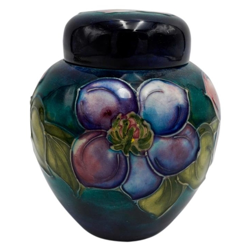 220 - MOORCROFT MAGNOLIA PATTERN COVERED JARCIRCA 1980signed and with impressed marks, 15cm high; together... 