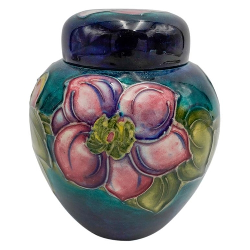 220 - MOORCROFT MAGNOLIA PATTERN COVERED JARCIRCA 1980signed and with impressed marks, 15cm high; together... 