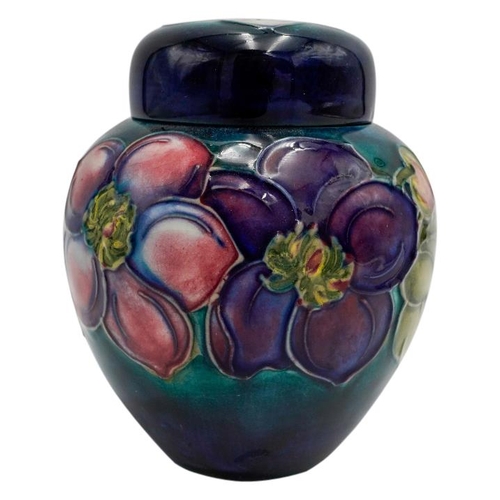 220 - MOORCROFT MAGNOLIA PATTERN COVERED JARCIRCA 1980signed and with impressed marks, 15cm high; together... 