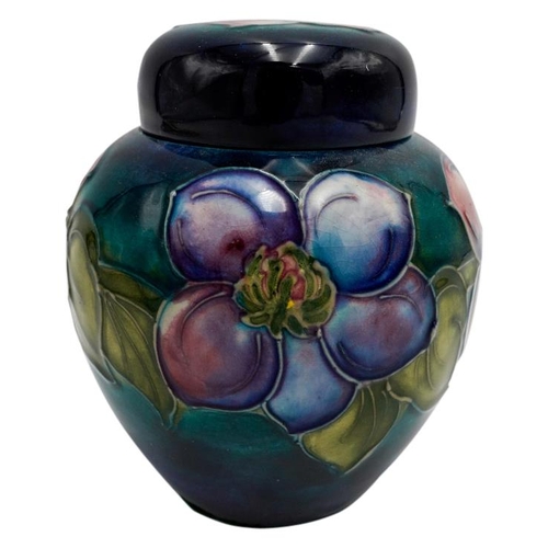 220 - MOORCROFT MAGNOLIA PATTERN COVERED JARCIRCA 1980signed and with impressed marks, 15cm high; together... 