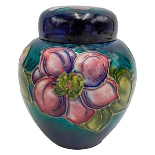 220 - MOORCROFT MAGNOLIA PATTERN COVERED JARCIRCA 1980signed and with impressed marks, 15cm high; together... 