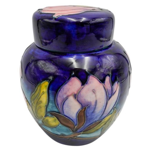 220 - MOORCROFT MAGNOLIA PATTERN COVERED JARCIRCA 1980signed and with impressed marks, 15cm high; together... 