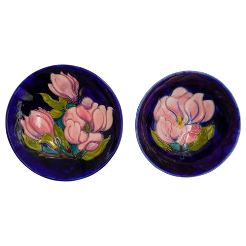 222 - TWO MOORCROFT MAGNOLIA PATTERN BOWLSdecorated with magnolias against a blue ground, painted and impr... 