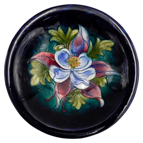 223 - LARGE WILLIAM MOORCROFT 'ORCHID' DEEP DISHCIRCA 1930-40decorated with a blossoming orchid on a blue ... 