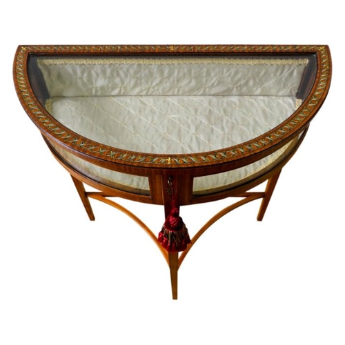 36 - EDWARDIAN PAINTED SATINWOOD DEMI LUNE VITRINECIRCA 1910the glazed hinged top enclosing a lined inter... 