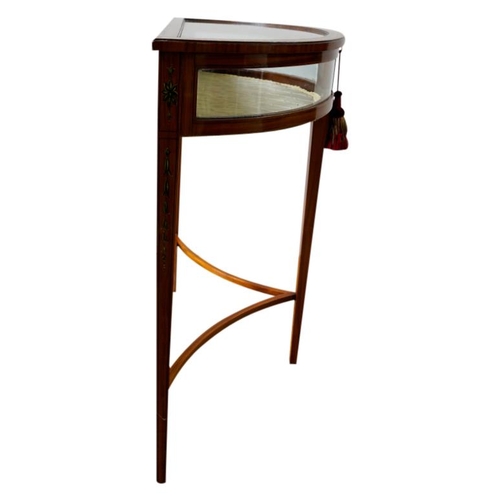 36 - EDWARDIAN PAINTED SATINWOOD DEMI LUNE VITRINECIRCA 1910the glazed hinged top enclosing a lined inter... 