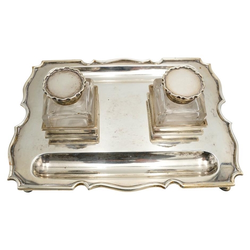 486 - EDWARDIAN SILVER INKWELLCHARLES STUART HARRIS, LONDON 1901the rectangular base surmounted by two cut... 