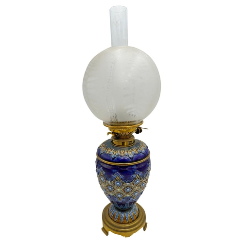 99 - DOULTON LAMBETH OIL LAMPCIRCA 1900raised on a gilt metal base63cm high (including chimney) PROVENANC... 