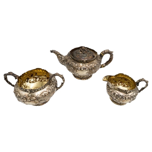 490 - GEORGE IV SILVER THREE PIECE TEA SERVICELONDON 1822comprising a teapot, creamer and a sugar bowl, wi... 