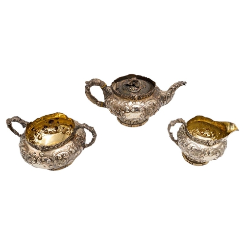 490 - GEORGE IV SILVER THREE PIECE TEA SERVICELONDON 1822comprising a teapot, creamer and a sugar bowl, wi... 