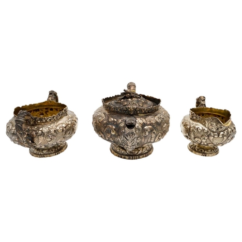 490 - GEORGE IV SILVER THREE PIECE TEA SERVICELONDON 1822comprising a teapot, creamer and a sugar bowl, wi... 