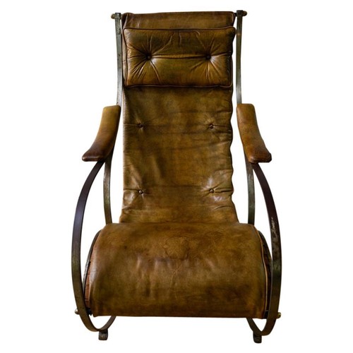 44 - A VICTORIAN STEEL AND LEATHER UPHOLSTERED ROCKING CHAIR BY R W WINFIELD19TH CENTURYof typical scroll... 