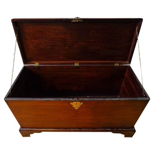 48 - GEORGE III MAHOGANY TRUNKMID 18TH CENTURYwith brass side carrying handles, the hinged top with a mou... 