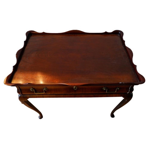 55 - GEORGE II MAHOGANY SILVER TABLECIRCA 1740the tray top with a serpentine edge, above and ogee moulded... 