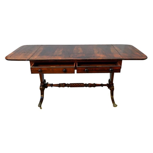 57 - GOOD REGENCY ROSEWOOD AND BRASS INLAID SOFA TABLECIRCA 1820the ebony line inlaid drop-leaf rounded r... 