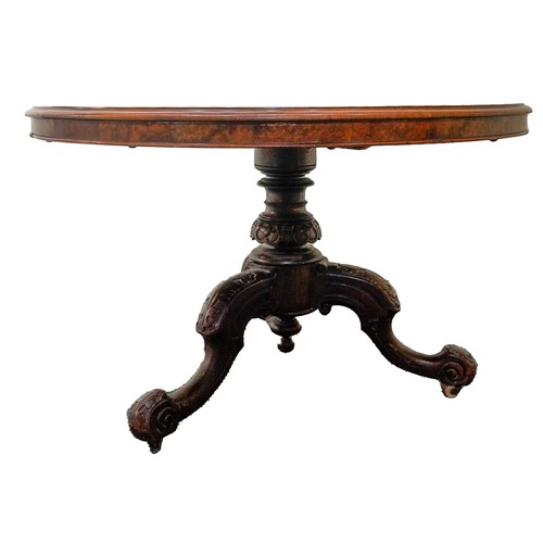 61 - VICTORIAN BURR WALNUT BREAKFAST TABLECIRCA 1860the circular tilt top raised on a carved column suppo... 