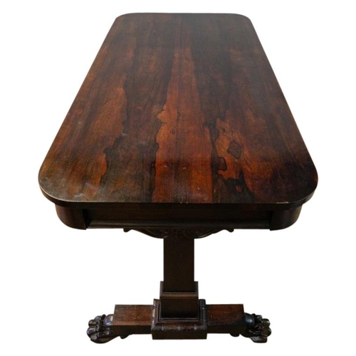 62 - GEORGE IV ROSEWOOD LIBRARY TABLECIRCA 1830the rounded rectangular top above two frieze drawers, rais... 