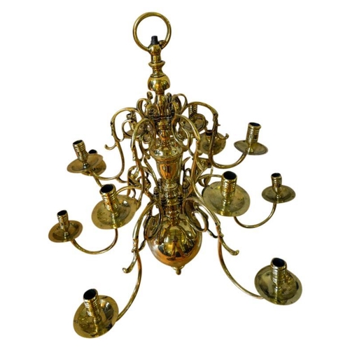 100 - NEAR PAIR OF DUTCH TWELVE-LIGHT BRASS CHANDELIERS19TH CENTURYthe multi-baluster shaft issuing two ti... 