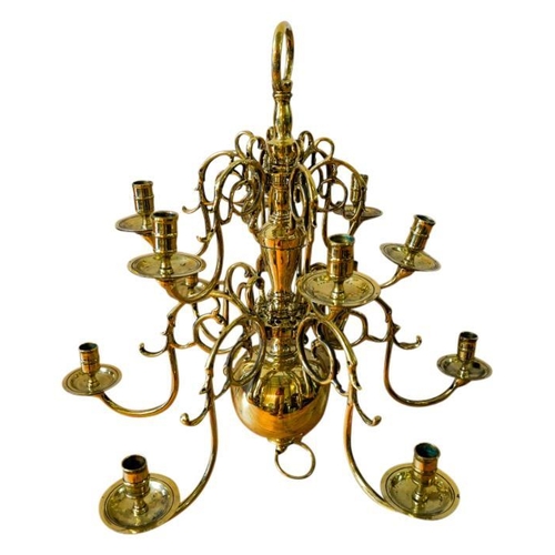 100 - NEAR PAIR OF DUTCH TWELVE-LIGHT BRASS CHANDELIERS19TH CENTURYthe multi-baluster shaft issuing two ti... 