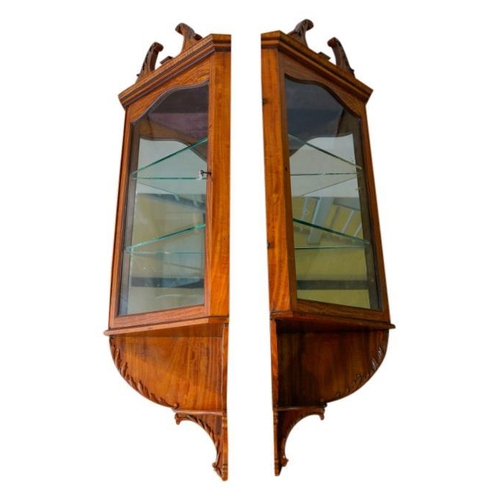 67 - PAIR OF EDWARDIAN SATINWOOD HANGING CORNER CABINETSCIRCA 1910in the George III style, the broken swa... 