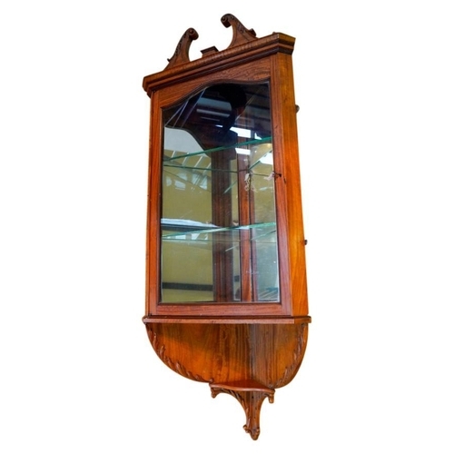 67 - PAIR OF EDWARDIAN SATINWOOD HANGING CORNER CABINETSCIRCA 1910in the George III style, the broken swa... 