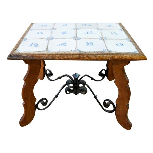 73 - SPANISH OAK, WROUGHT IRON AND TILE INLAID LOW TABLE19TH CENTURYthe rectangular top inset with twelve... 