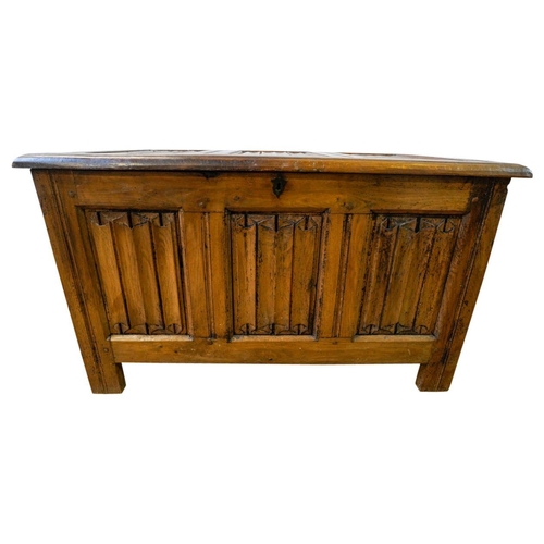 77 - FRENCH GOTHIC CARVED OAK COFFER17TH CENTURYwith a triple linen fold panelled lid and conforming fron... 