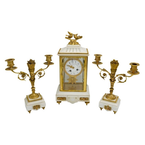 120 - LOUIS XVI STYLE MARBLE AND GILT-BRONZE MOUNTED CLOCK GARNITURECIRCA 1900the four glass clock with a ... 