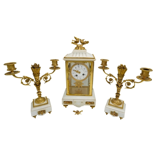 120 - LOUIS XVI STYLE MARBLE AND GILT-BRONZE MOUNTED CLOCK GARNITURECIRCA 1900the four glass clock with a ... 