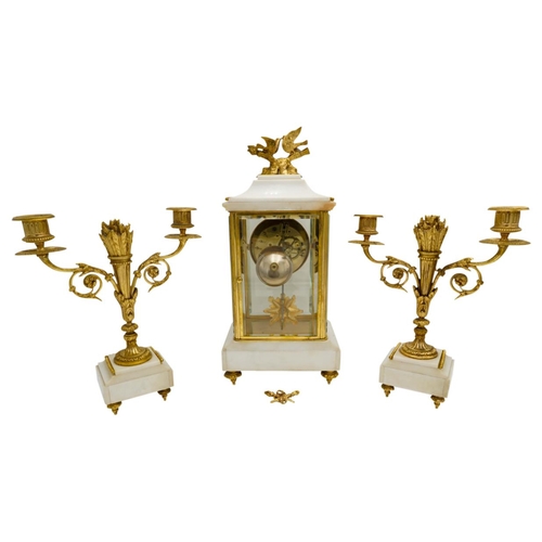 120 - LOUIS XVI STYLE MARBLE AND GILT-BRONZE MOUNTED CLOCK GARNITURECIRCA 1900the four glass clock with a ... 