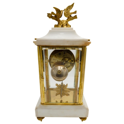 120 - LOUIS XVI STYLE MARBLE AND GILT-BRONZE MOUNTED CLOCK GARNITURECIRCA 1900the four glass clock with a ... 