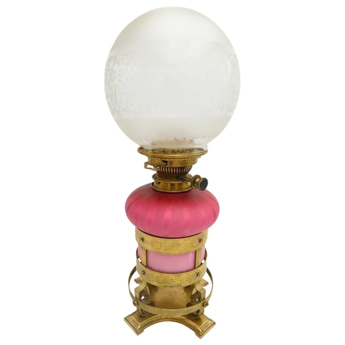 101 - 'ARTS AND CRAFTS' GLASS AND GILT-METAL OIL LAMP BY HINKS AND SONSCIRCA 1900the pink glass reservoir ... 