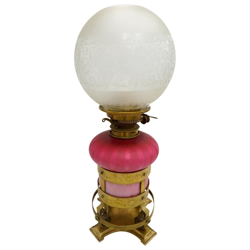 101 - 'ARTS AND CRAFTS' GLASS AND GILT-METAL OIL LAMP BY HINKS AND SONSCIRCA 1900the pink glass reservoir ... 