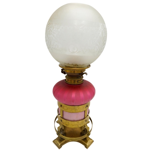 101 - 'ARTS AND CRAFTS' GLASS AND GILT-METAL OIL LAMP BY HINKS AND SONSCIRCA 1900the pink glass reservoir ... 