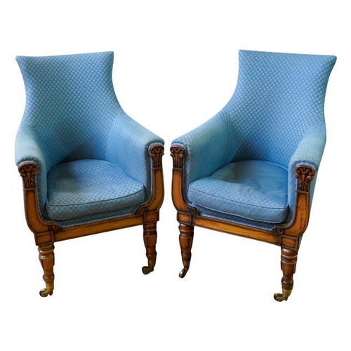 82 - A PAIR OF REGENCY MAHOGANY AND UPHOLSTERED LIBRARY CHAIRSCIRCA 1820covered in patterned blue fabric,... 