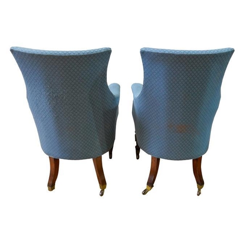 82 - A PAIR OF REGENCY MAHOGANY AND UPHOLSTERED LIBRARY CHAIRSCIRCA 1820covered in patterned blue fabric,... 