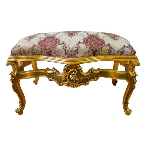 83 - LOUIS XV STYLE GILTWOOD AND UPHOLSTERED STOOLthe serpentine shaped stuffed over seat, raised on roco... 