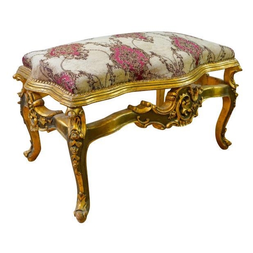 83 - LOUIS XV STYLE GILTWOOD AND UPHOLSTERED STOOLthe serpentine shaped stuffed over seat, raised on roco... 