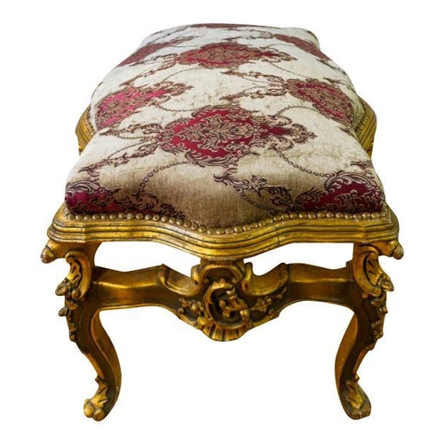 83 - LOUIS XV STYLE GILTWOOD AND UPHOLSTERED STOOLthe serpentine shaped stuffed over seat, raised on roco... 