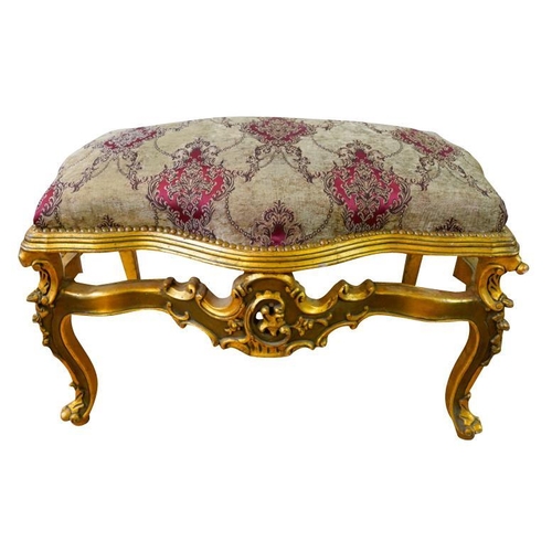 83 - LOUIS XV STYLE GILTWOOD AND UPHOLSTERED STOOLthe serpentine shaped stuffed over seat, raised on roco... 