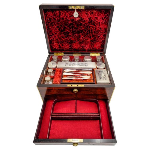 446 - A VICTORIAN BRASS BOUND ROSEWOOD DRESSING CASE, by I Turrill, 250 Regent Street, the fitted interior... 