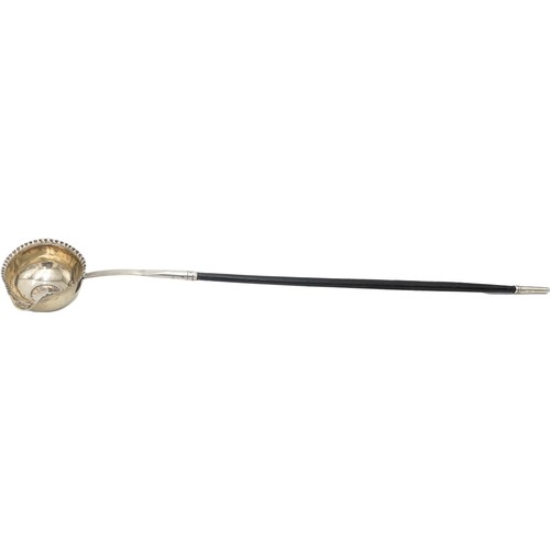 509 - GEORGIAN SILVER AND HORN HANDLED PUNCH LADLE18TH CENTURYinset with a coin38cm longPROVENANCE : Priva... 