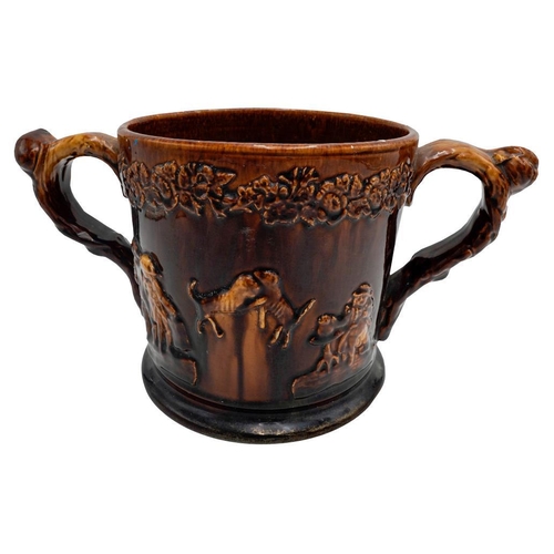 200 - VICTORIAN TWO-HANDLED 'FROG' TANKARD 19TH CENTURYcovered in a rich brown-treacle glaze, the interior... 