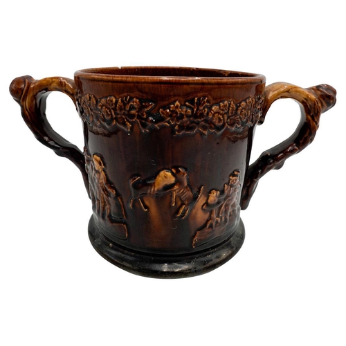 200 - VICTORIAN TWO-HANDLED 'FROG' TANKARD 19TH CENTURYcovered in a rich brown-treacle glaze, the interior... 