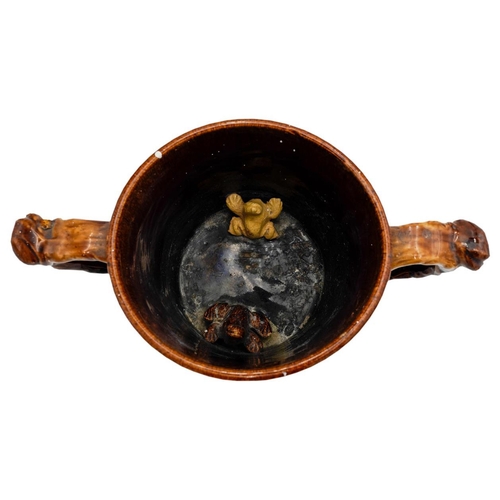 200 - VICTORIAN TWO-HANDLED 'FROG' TANKARD 19TH CENTURYcovered in a rich brown-treacle glaze, the interior... 