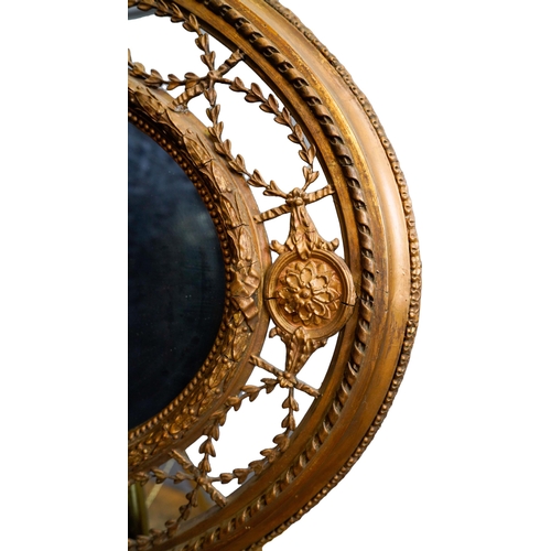 84 - VICTORIAN GILTWOOD AND GESSO OVAL WALL MIRROR19TH CENTURYthe oval plate within an ornate openwork fr... 