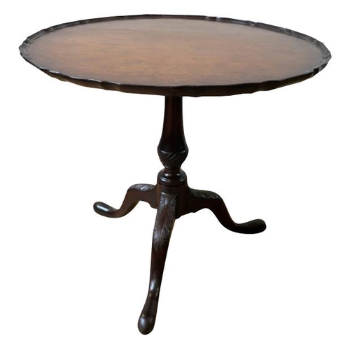 91 - GEORGE III STYLE MAHOGANY TRIPOD TABLE19TH CENTURYthe circular top with a piecrust edge, raised on a... 