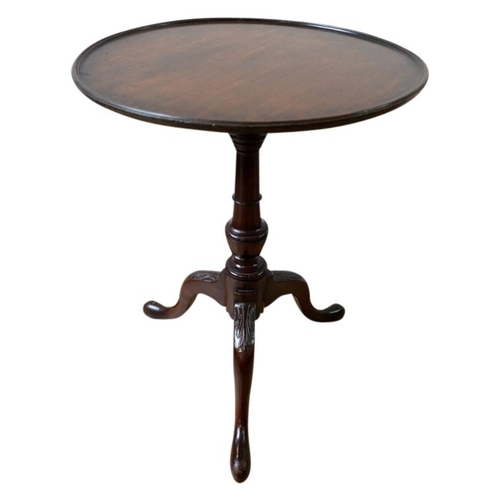 92 - MAHOGANY TRIPOD TABLE18TH CENTURY OR LATERthe circular dish top raised on a vasiform column support ... 