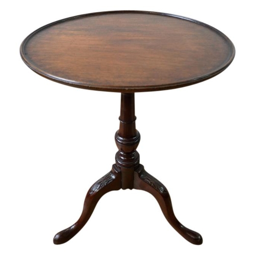 92 - MAHOGANY TRIPOD TABLE18TH CENTURY OR LATERthe circular dish top raised on a vasiform column support ... 